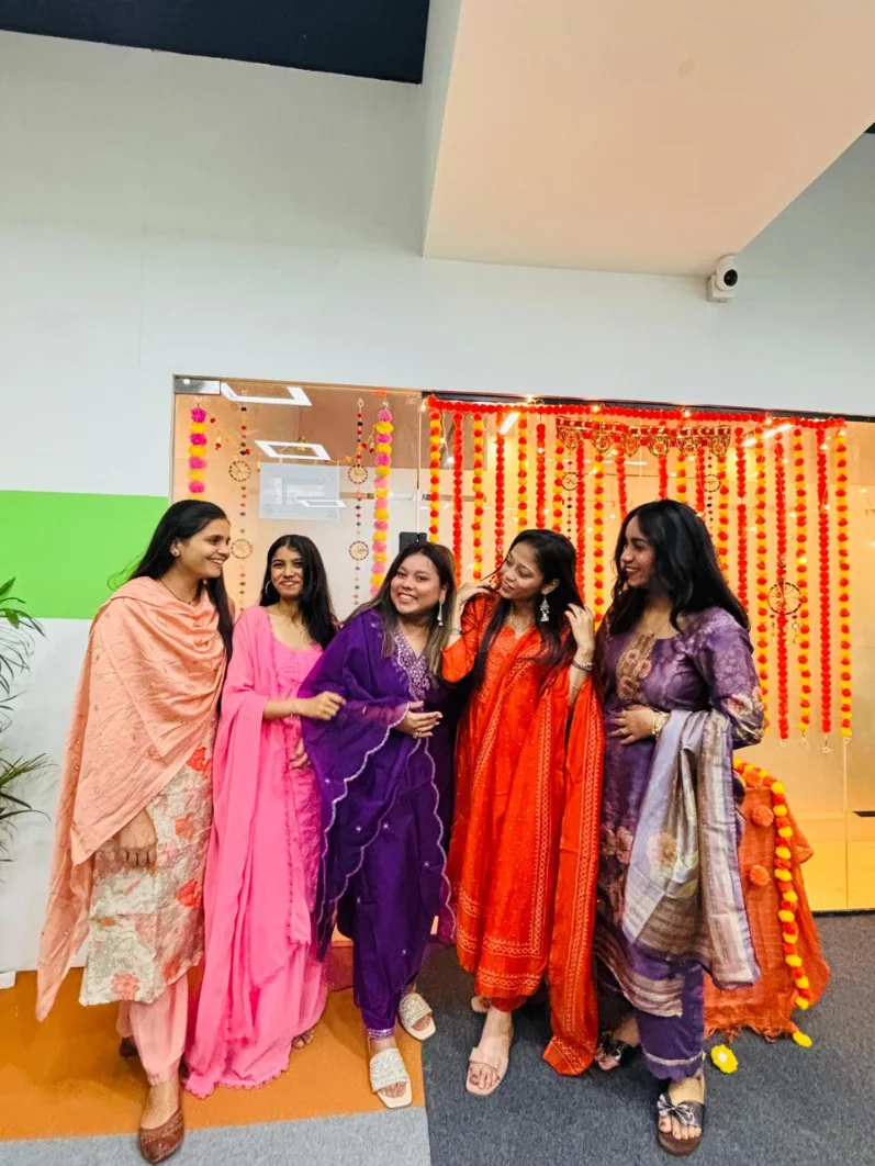 Graphketing team collaborating during a celebration in the office